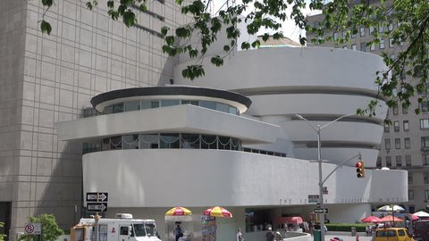 NEW YORK CITY, USA - MAY 19, 2017: Dolly shot moving alongside Guggenheim Museum. The Solomon R. Guggenheim Museum in New York City was the first Guggenheim Museum established.