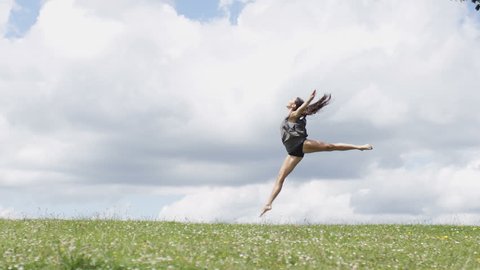 Young dancer dances in nature outdoors, in slow motion Stockvideo
