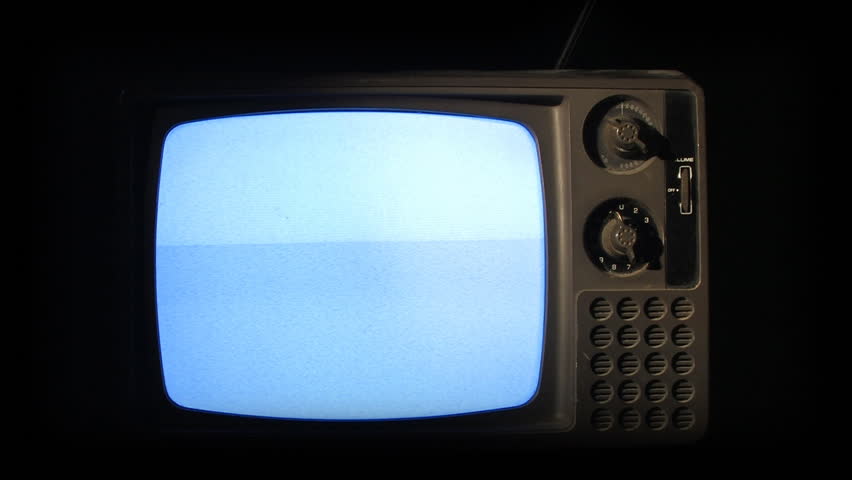 An old retro television turns off.  Static on screen.