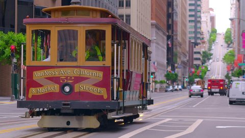 SAN FRANCISCO, CA - CIRCA APRIL 2017: San Francisco cable car drives downtown city street. 4K.