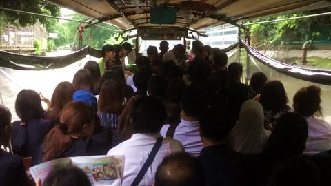 Express boat service in timelape with full of people in rush hour : Bangkok, Thailand : June  9, 2017