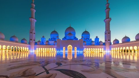 ABU DHABI, UAE - MAY 2017: Panoramic timelapse of Sunset in Sheikh Zayed Mosque in Abu Dhabi, United Arab Emirates. Transition of the day at night