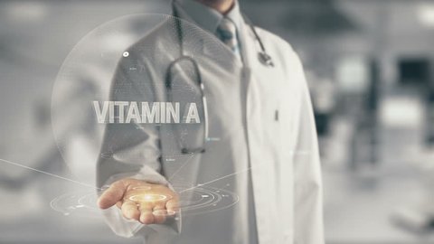 Doctor holding in hand Vitamin A
