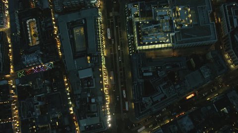 Aerial view at night of illuminated rooftops and commuter traffic in Regent Street London UK RED DRAGON