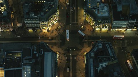 Aerial night view of traffic and illuminated shop buildings in Oxford Street in London UK RED DRAGON