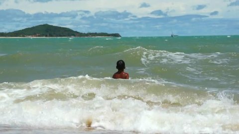 Boy catching waves