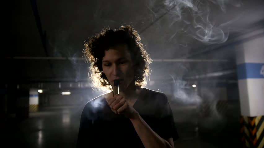 Vaper smiling in the camera lens