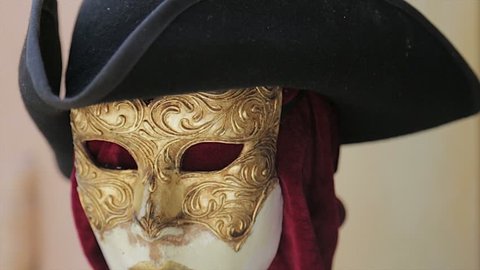 Mannequin with gold face mask of the carnival of Venice, Italy