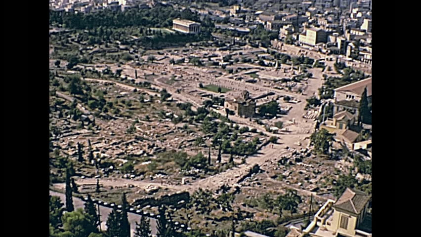 Ancient Athens Agora aerial view from Acropolis hill with close up on ancient Greek Temple of Efesto ruins. Restored historical 70s archival footage on 1972 in Greece.