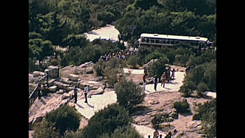 Odeon of Herodes Atticus aerial view from Acropolis hill with close up on theater ruins, southwest slope of the Acropolis of Athens in Greece. Restored historical 70s archival footage on 1972.