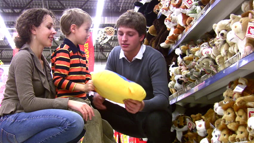 family with boy in toy shop 