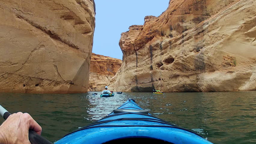 POV, point of view with go pro of kayakers paddling on Lake Powell in the Glen Canyon National Recreation Area.  Kayakers are in Antelope Canyon. Royalty-Free Stock Footage #28124725