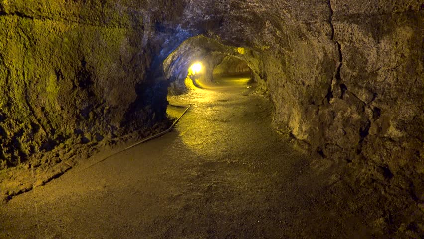 Tourist in the Thurston Lava Tube (Nahuku). Volcanoes NP, Big Island, Hawaii, USA