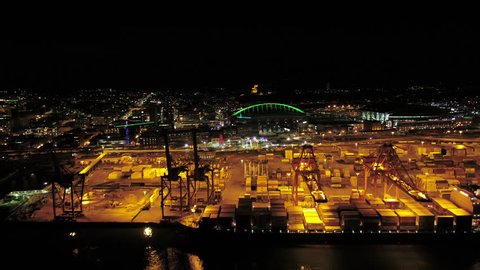 Seattle Aerial v87 Flying low around and over shipyard at night with cityscape views 4/17