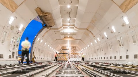 Loading air cargo freighter inside aircraft - Zoom out