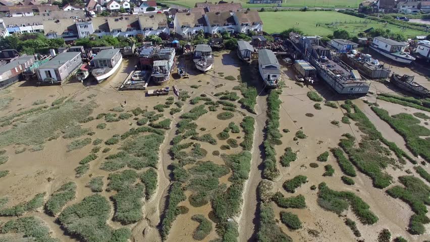 Artistic boathouses, Adur river, Shoreham-by-Sea, UK, view from above, high resolution 4k aerial drone video, close-up