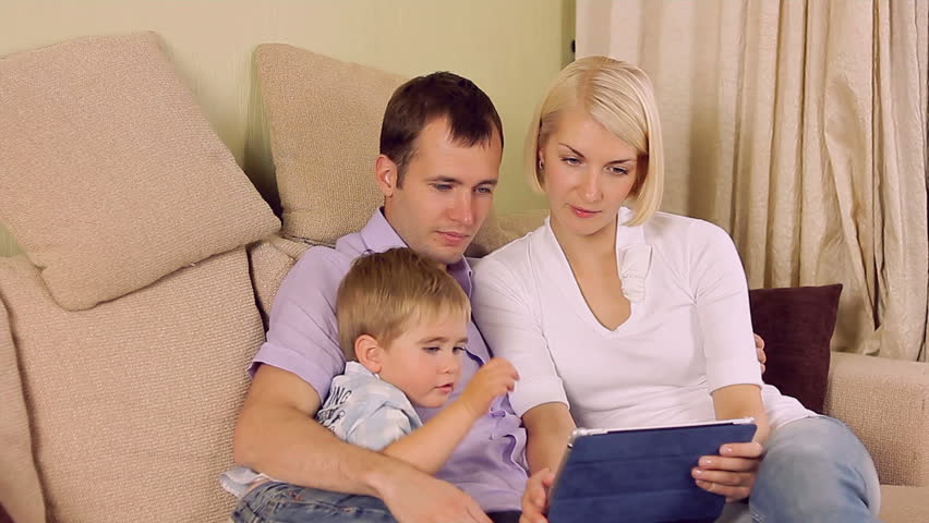 Family with a tablet pc at home