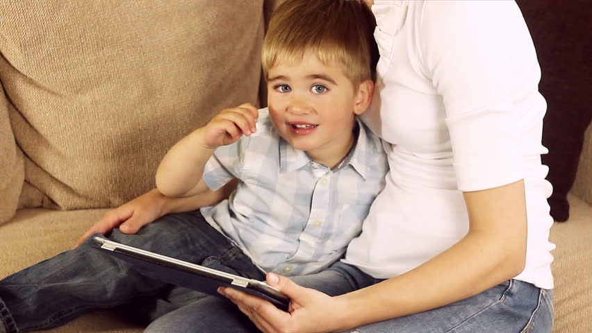 Family with a tablet pc at home