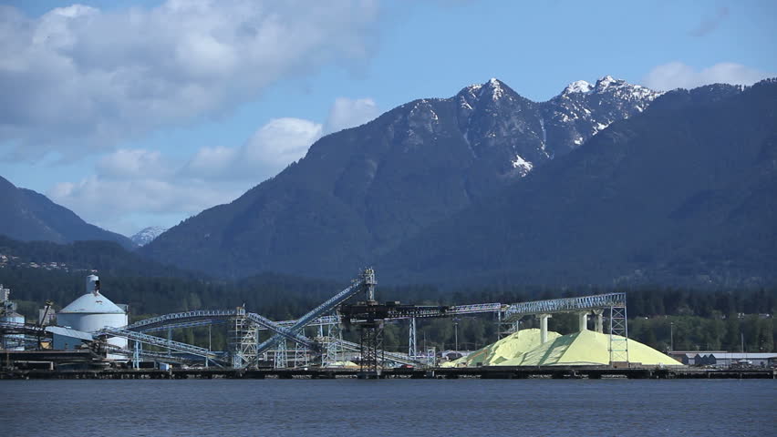 Piles of yellow Sulfur on Dock of Chemical Processing Factory in Vancouver,