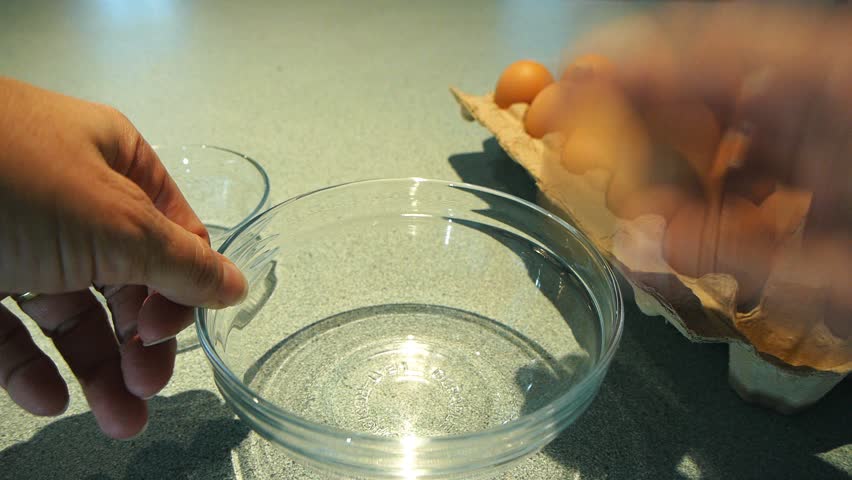 Cracking an egg into a bowl | Shutterstock HD Video #2817244