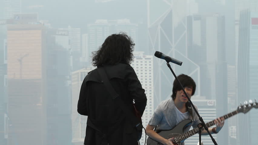 HONG KONG - NOVEMBER 14: Young rock band performing at free open air music