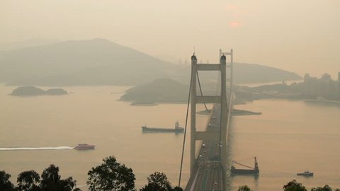 Tsing Ma Bridge and  ship at Sunset - Tsing Ma Bridge is a bridge in Hong Kong. It is the world's seventh-longest span suspension bridge.