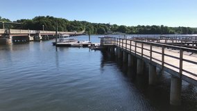 View of a walkway and floating docks plus footbridge from the Belfast, Maine waterfront.
