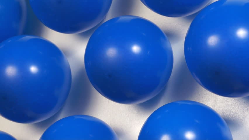 Blue balloons popping at carnival