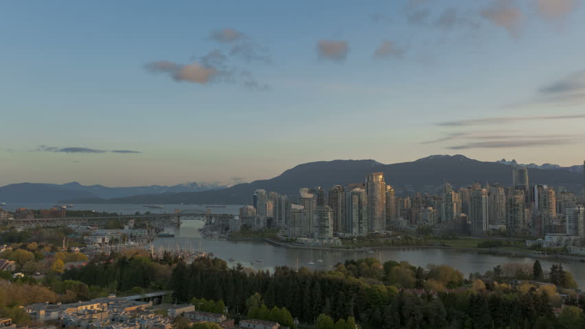 Timelapse sunrise at Vancouver Skyline with boats on the river