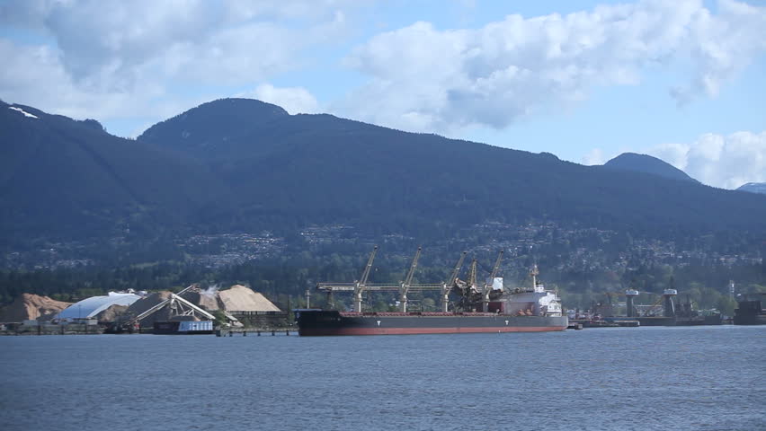 Discharging a shipment from a Cargo Freighter moored at Vancouver Habor