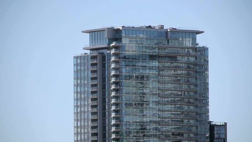 VANCOUVER, CANADA, CIRCA 2011: Waterplane take-off and flying near a skyscraper