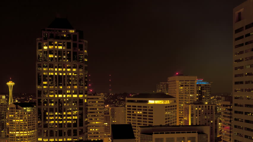 Time lapse of the shadow moving through Skyscrapers in Seattle during dawn and