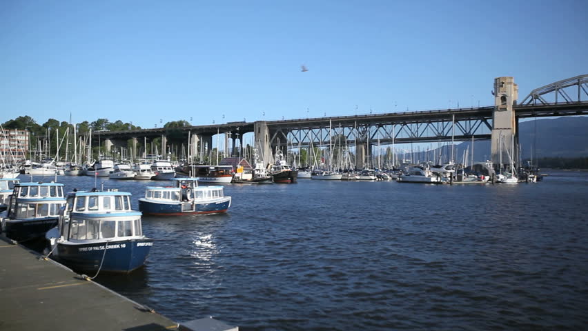 VANCOUVER, CANADA, MAY 22, 2012: Boat crossing Vancouver Granville Island Harbor