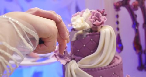 Detail of wedding cake cutting by newlyweds. wedding cake. Stock Video