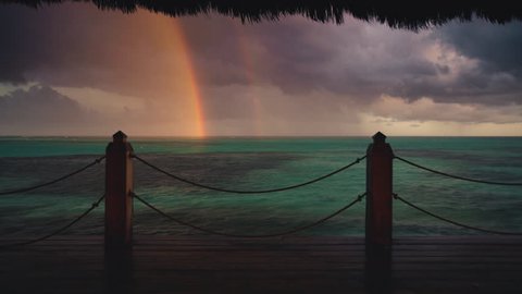 Rainbow after tropical rain in caribbean sea Stock Video