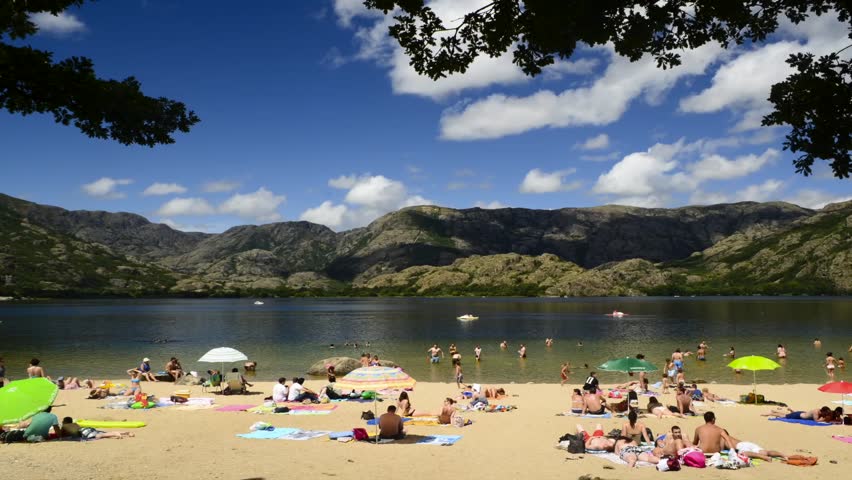SANABRIA, SPAIN - CIRCA AUGUST 2012: Time lapse of people in the beach of