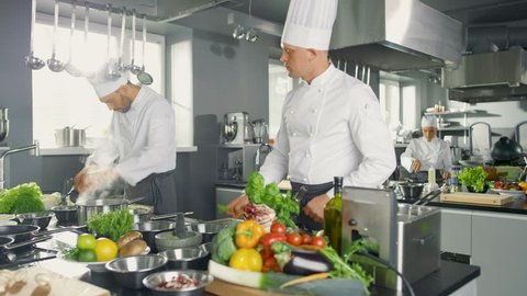 famous chef works big restaurant kitchen Stock Footage Video (100%
