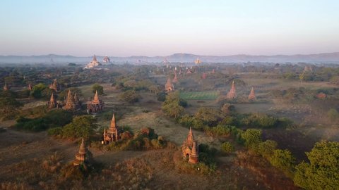 Aerial shot of the Bagan archeological site in Myanmar, overview of hundreds of pagodas and shrines .