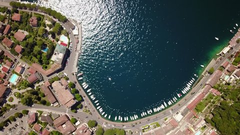 Aerial shot of the harbour of Toscalano Maderno, a town on the shores of Lago di Garda, Italy