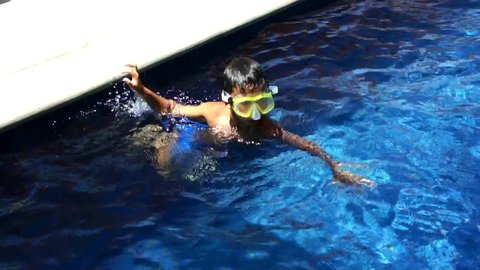 Young boy swiming in the pool