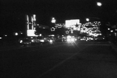 HOLLYWOOD CALIFORNIA - DECEMBER 2:  Vintage super 8 night time lapse  footage of Christmas holiday lights and traffic on December 2, 1986 in Hollywood, California.  Editorial Stock Video
