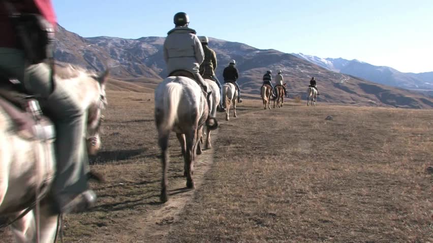 Cadrona, New Zealand, June 2011. Unidentified tourists on horse trek through