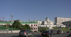 4K video footage view of beautiful old Pashkov's House mansion and traffic in center of Moscow city next to Moscow River near Red Square and Kremlin on sunny summer morning in central Russia