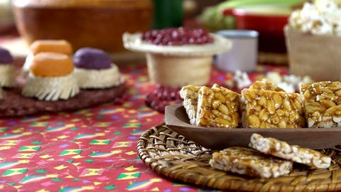 Typical Brazilian junina party sweets. Pe de moleque and pacoca. Stock Video