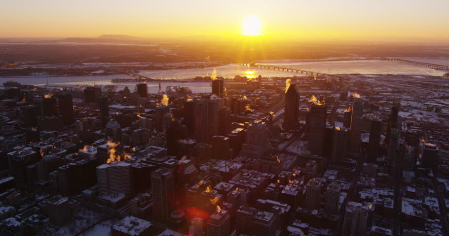 Aerial - Warm Sun Rises Above Cold City Skyline in Winter, Montreal,
