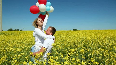 happy couple with balloons