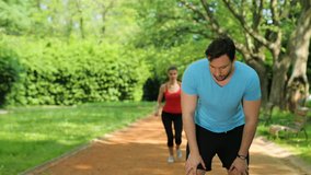 Exhausted man and woman catching breath after jogging, running at the park. Tired couple. close up - Powered by Shutterstock - Get 15% off with code: PIKWIZARD15