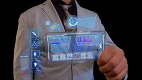 Man with a futuristic screen. The concept of the future interface on a transparent display - Powered by Shutterstock - Get 15% off with code: PIKWIZARD15