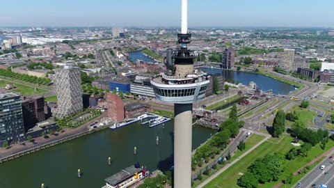 Aerial footage circling around Euromast an observation tower in Rotterdam Netherlands it was specially built for the 1960 Floriade and is a listed monument since 2010 very tall structure 4k quality