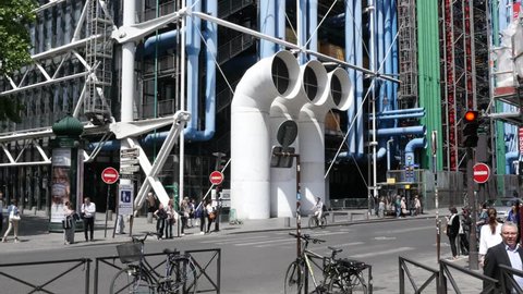 PARIS, FRANCE - MAY 23, 2017: Traffic And The Tubes Pipes Facade Of Bizarre Architecture Building Of Pompidou Center In Paris